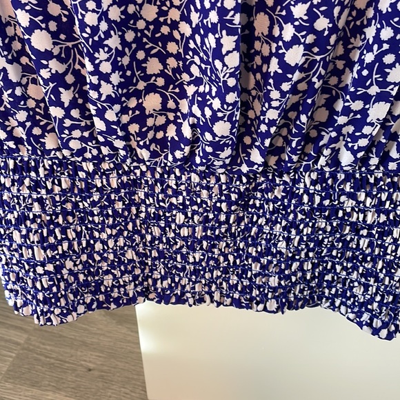 Faux wrap top with a snap closure & smocked at the  waist. - Picture 7 of 7